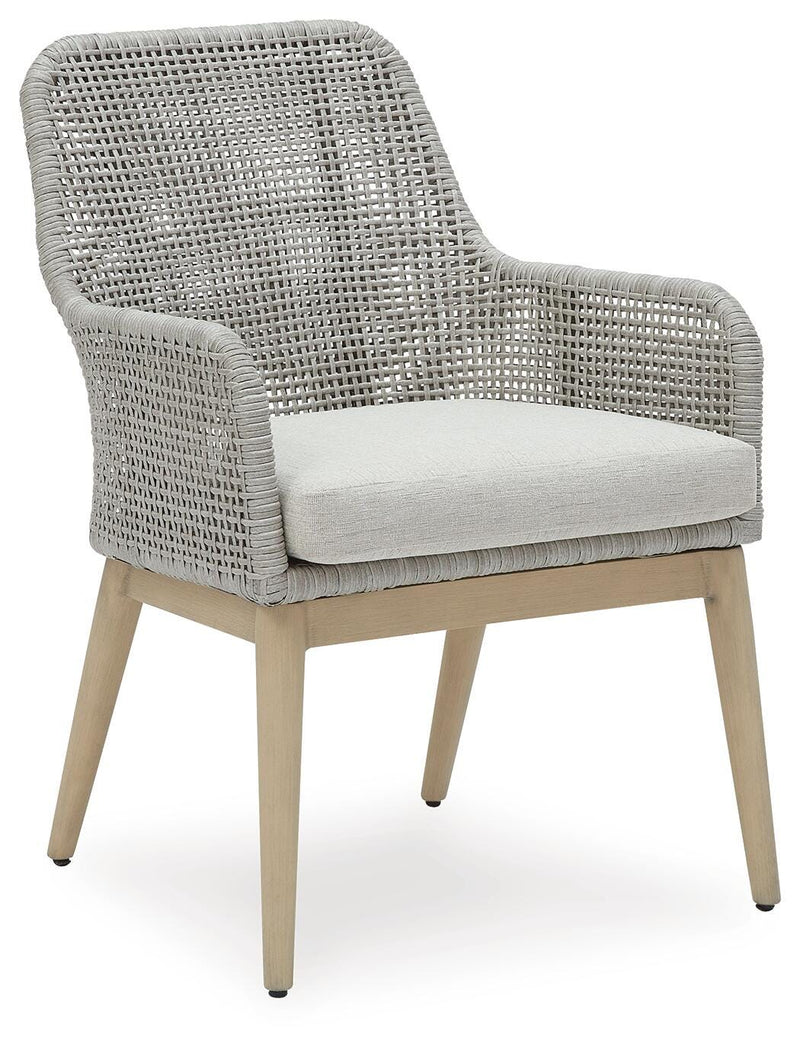 Ashley Furniture Seton Creek outdoor seating set with cushioned chairs and table, designed for patio or garden relaxation.
