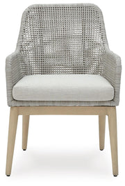 Ashley Furniture Seton Creek outdoor seating set with cushioned chairs and a matching table, ideal for patio relaxation.