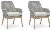 Ashley Furniture Seton Creek outdoor seating set with cushioned chairs and table, ideal for patio or backyard relaxation.