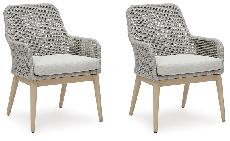 Ashley Furniture Seton Creek outdoor seating set with cushioned chairs and table, ideal for patio or backyard relaxation.