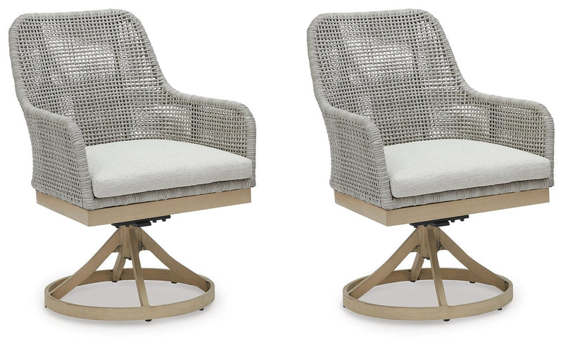 Seton Creek outdoor seating set by Ashley Furniture with cushioned chairs and a matching table for patio relaxation.
