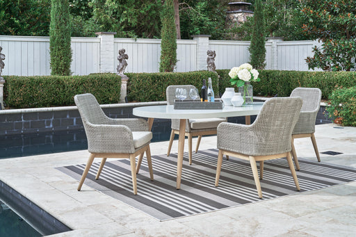 Outdoor dining set from Ashley Furniture's Seton Creek collection, featuring a table and chairs for outdoor dining.