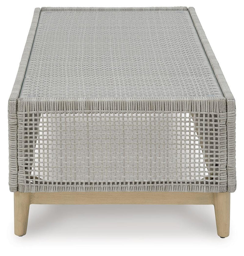 Ashley Furniture Seton Creek outdoor upholstery set with a table and chairs, featuring weather-resistant cushions and stylish design.