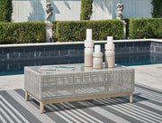 Ashley Furniture Seton Creek outdoor upholstery set with table and chairs, featuring weather-resistant cushions and stylish design.