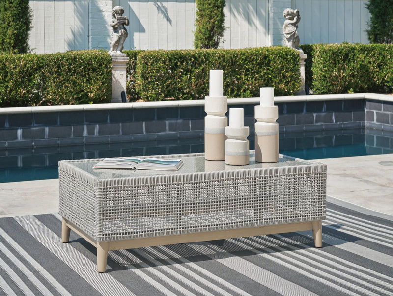 Ashley Furniture Seton Creek outdoor upholstery set with table and chairs, featuring weather-resistant cushions and stylish design.