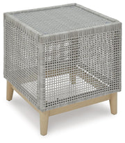 Ashley Furniture Seton Creek outdoor seating set with cushioned chairs and a matching table, ideal for patio relaxation.