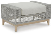 Seton Creek outdoor seating set by Ashley Furniture with cushioned chairs and a matching table, ideal for patio relaxation.