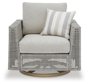 Seton Creek outdoor upholstery set featuring a stylish outdoor table and chairs from Ashley Furniture, with cushioned seating and table surface.