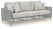 Ashley Furniture Seton Creek outdoor upholstery set with table and chairs, featuring weather-resistant cushions and stylish design.