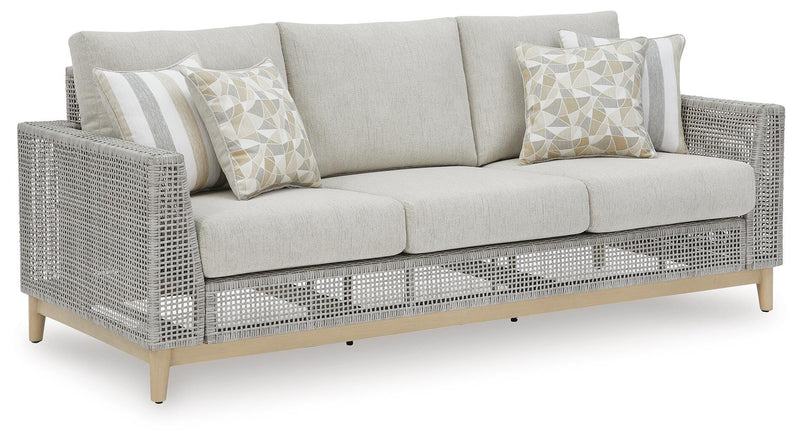 Ashley Furniture Seton Creek outdoor upholstery set with table and chairs, featuring weather-resistant cushions and stylish design.