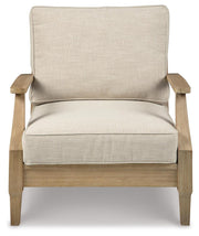 Ashley Furniture Clare View outdoor seating set with cushioned chairs and table, perfect for patio relaxation.