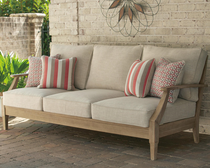 Ashley Furniture Clare View outdoor seating set with cushioned chairs and table, ideal for patio relaxation.