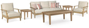 Ashley Furniture Clare View outdoor seating set with cushioned chairs and matching table, perfect for patio relaxation.