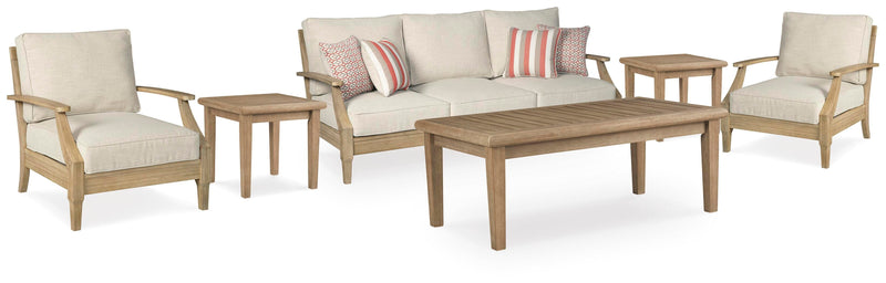 Ashley Furniture Clare View outdoor seating set with cushioned chairs and matching table, perfect for patio relaxation.