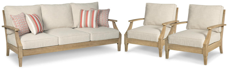 Outdoor Ashley Furniture Clare View outdoor seating set with cushioned chairs and a matching table on a patio.