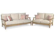 Ashley Furniture Clare View outdoor seating set with cushioned chairs and table, ideal for patio or garden relaxation.