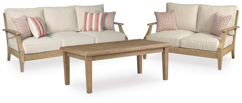 Ashley Furniture Clare View outdoor seating set with cushioned chairs and table, ideal for patio relaxation and outdoor dining.