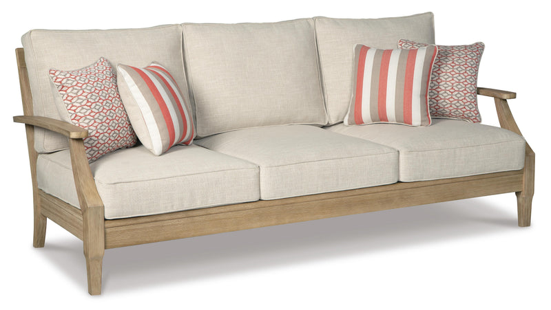 Ashley Furniture Clare View outdoor seating set with cushioned chairs and a matching table, shown from an angled view.