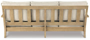 Ashley Furniture Clare View outdoor seating set, view of cushioned chairs and table in a cozy outdoor space.