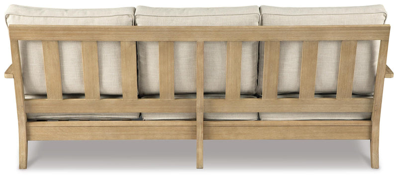 Ashley Furniture Clare View outdoor seating set, view of cushioned chairs and table in a cozy outdoor space.