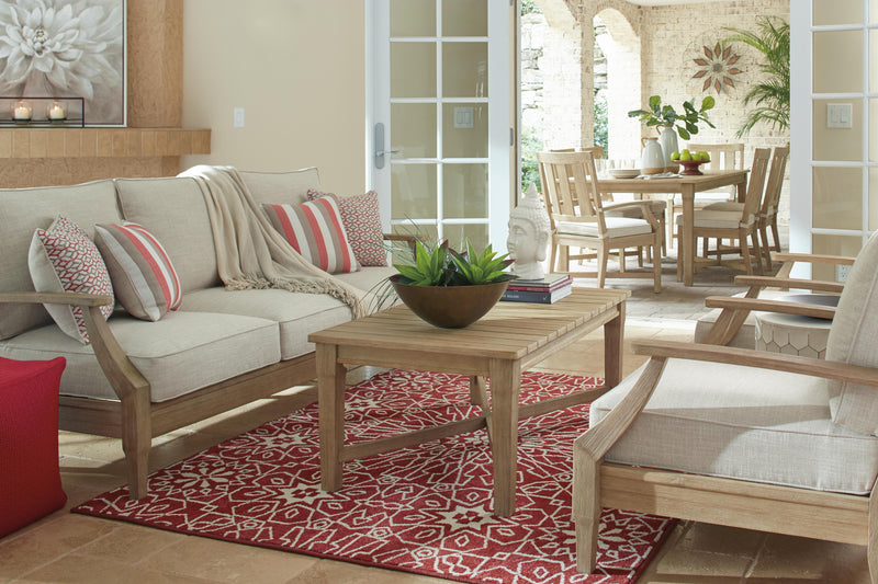 Ashley Furniture Clare View outdoor sofa with cushion, featuring stylish seating and comfortable padding for outdoor living spaces.