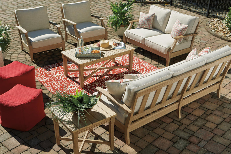 Ashley Furniture Clare View outdoor sofa with cushion, featuring stylish design and comfortable seating for outdoor spaces.