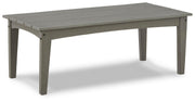 Ashley Furniture Visola outdoor occasional table set with two stylish tables featuring metal frames and glass tops.
