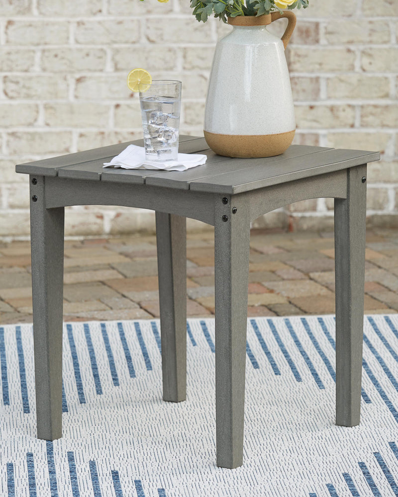 Ashley Furniture Visola outdoor occasional table set with two round tables and woven rattan design for patio or garden use.