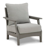 Ashley Furniture Visola outdoor sofa and loveseat set with table, featuring stylish cushions and a sturdy metal frame, angled view.