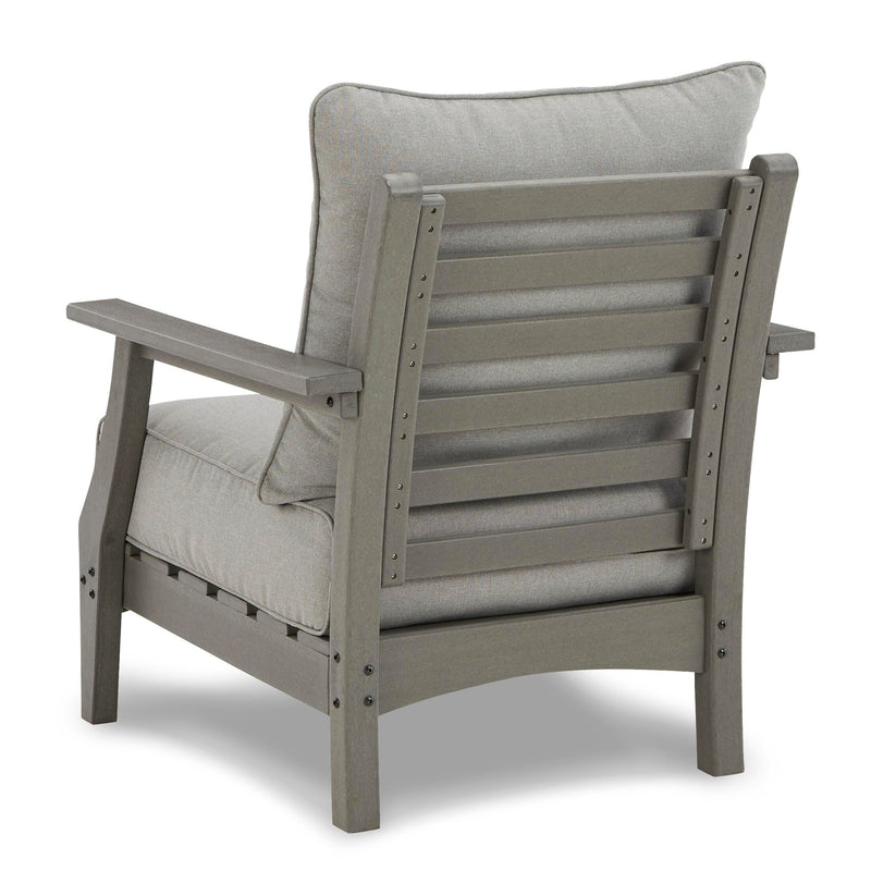 Ashley Furniture Visola outdoor sofa and loveseat set with matching table, featuring cushioned seating and modern outdoor design.