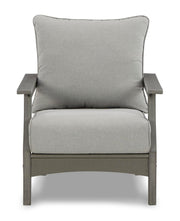 Ashley Furniture Visola outdoor sofa and loveseat set with matching table, featuring stylish cushions and a modern outdoor design.