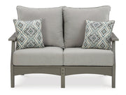 Ashley Furniture Visola outdoor sofa and loveseat set with matching table, featuring cushioned seats and a stylish outdoor design.