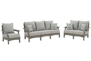Ashley Furniture Visola outdoor seating set with cushioned chairs and table, perfect for patio relaxation.