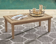 Gerianne outdoor cocktail table by Ashley Furniture featuring a sleek, modern design with a sturdy surface for outdoor use.