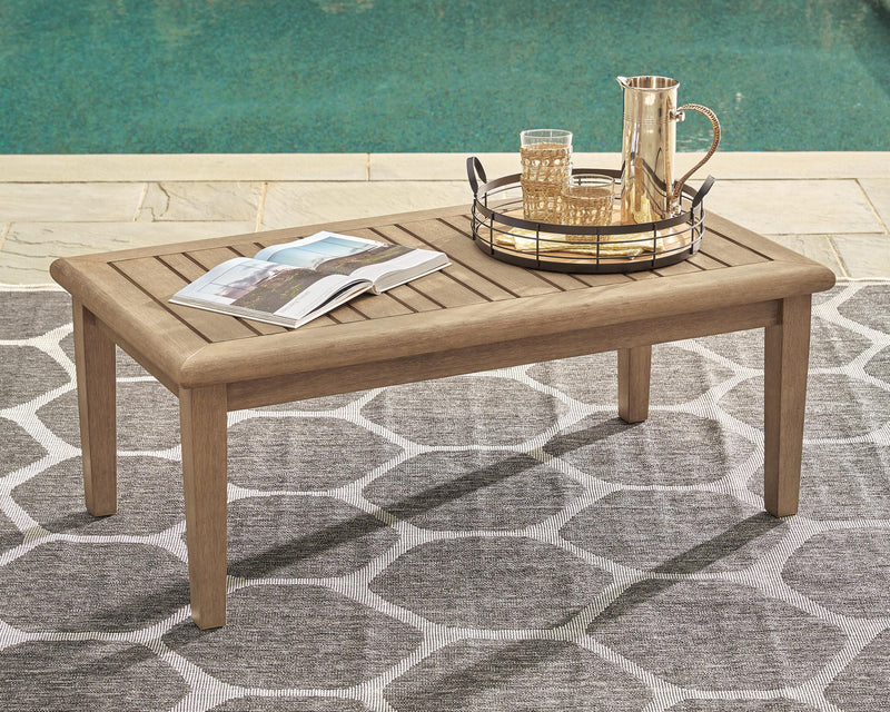 Gerianne outdoor cocktail table by Ashley Furniture featuring a sleek, modern design with a sturdy surface for outdoor use.