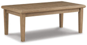 Outdoor Ashley Furniture Clare View outdoor seating set with cushioned chairs and table, shown from an angle in a garden setting.