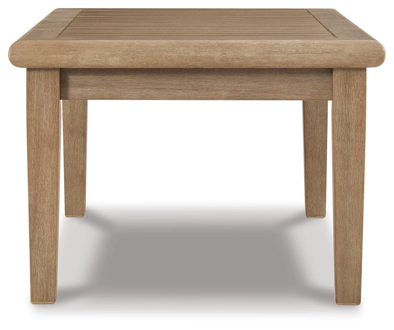 Outdoor Ashley Furniture Gerianne coffee table with a round top and slatted design, perfect for outdoor cocktail gatherings.