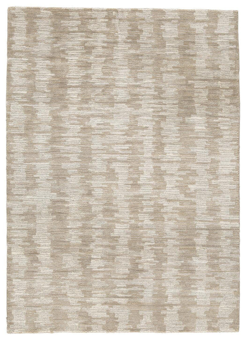 Ashley Furniture Abanlane 5' x 7' rug with intricate patterns and soft texture, ideal for living rooms and bedrooms.
