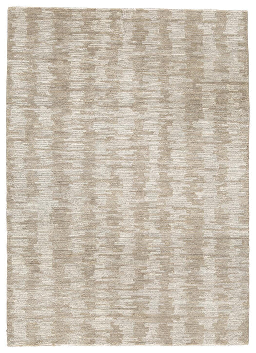 Ashley Furniture Abanlane 5' x 7' rug with intricate patterns and soft texture, ideal for living rooms and bedrooms.
