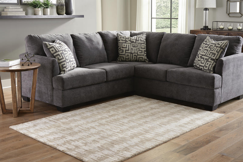 Ashley Furniture Abanlane 5x7 rug with intricate pattern and soft texture, ideal for living rooms or bedrooms.