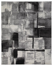 Medium Ashley Furniture Brycebourne 5'3" x 7'7" rug with intricate patterns and soft texture, shown in a cozy living room setting.