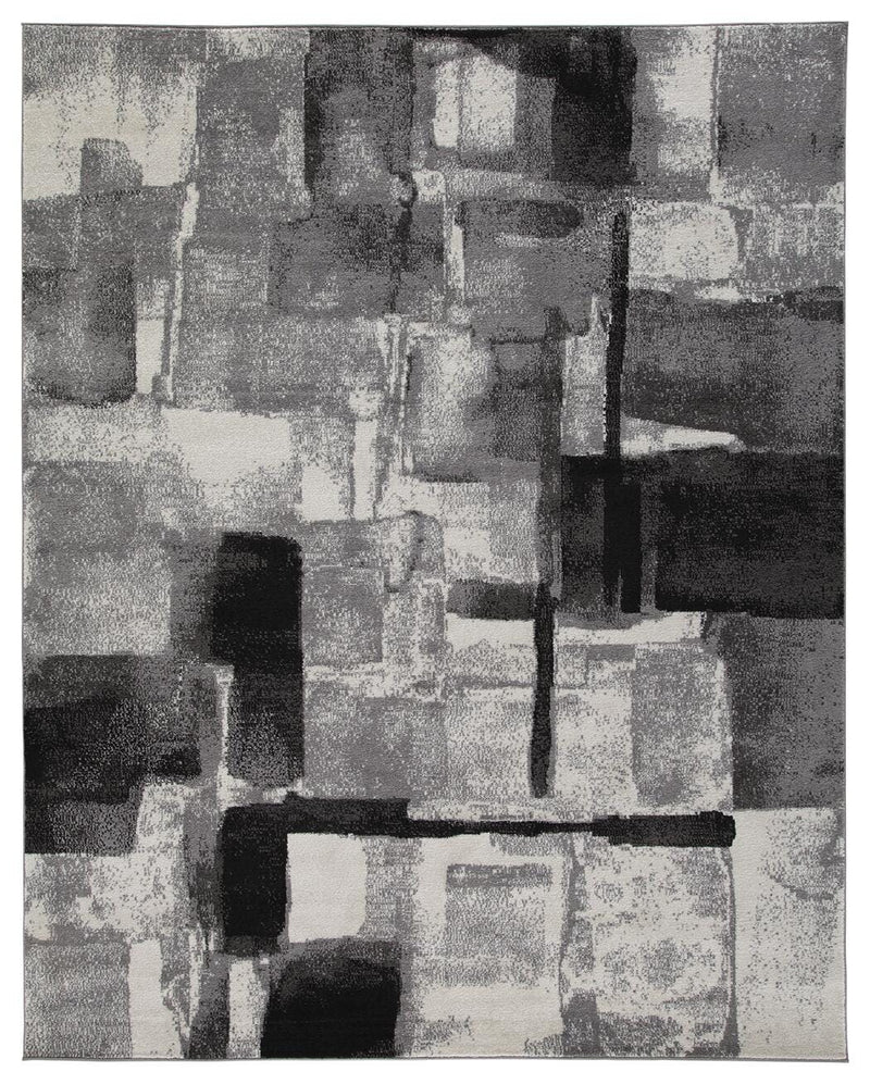 Medium Ashley Furniture Brycebourne 5'3" x 7'7" rug with intricate patterns and soft texture, shown in a cozy living room setting.