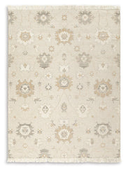 Ashley Furniture Calkin Rug with a soft, woven texture in neutral tones, perfect for living room or bedroom decor.