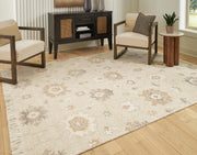 Ashley Furniture Calkin Rug with intricate patterns and warm tones, ideal for adding style to living room or bedroom flooring.
