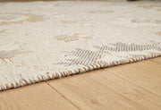 Close-up of Ashley Furniture Calkin Rug showcasing detailed woven pattern and textured fabric.