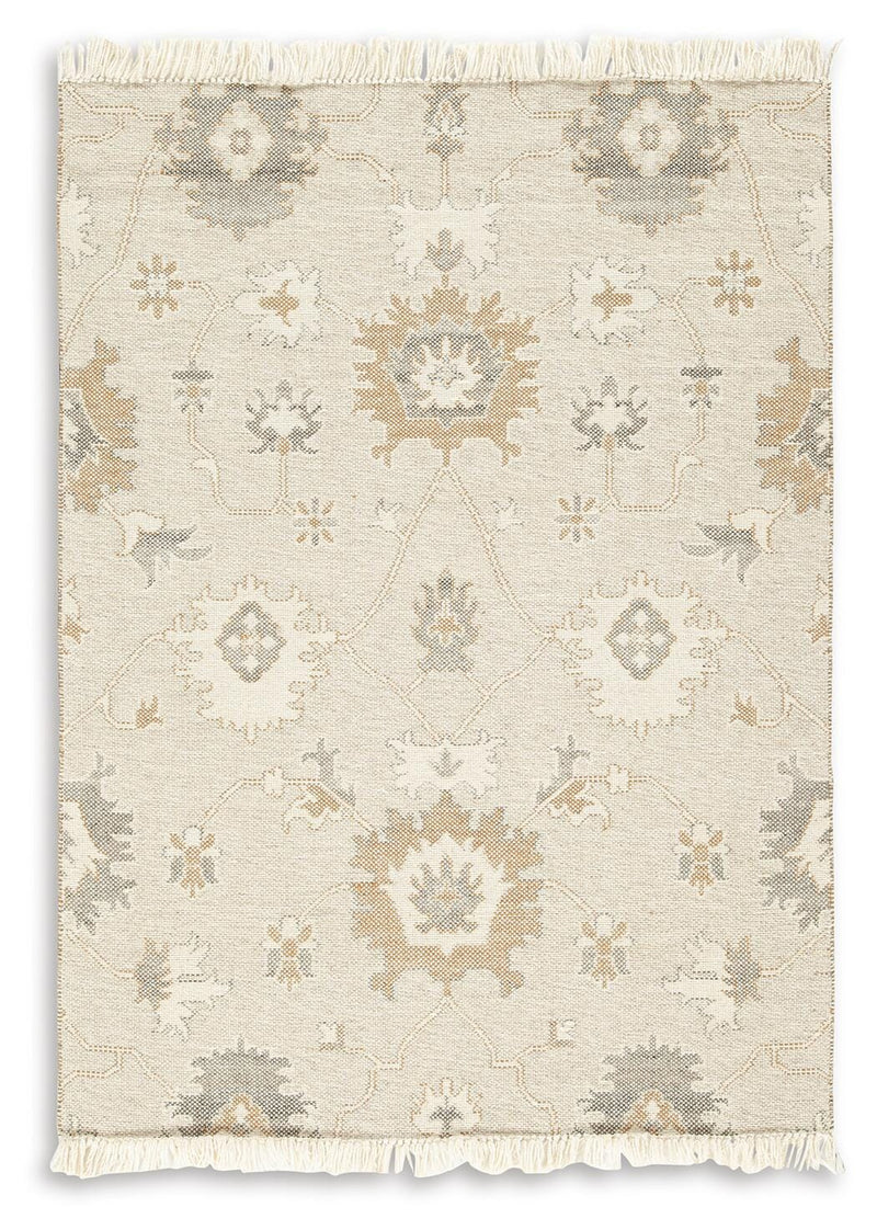 Ashley Furniture Calkin Rug with intricate patterns and warm tones, showcasing a soft, woven texture for cozy living spaces.