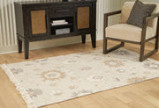 Ashley Furniture Calkin Rug featuring a textured pattern in neutral tones, ideal for adding warmth to living spaces.