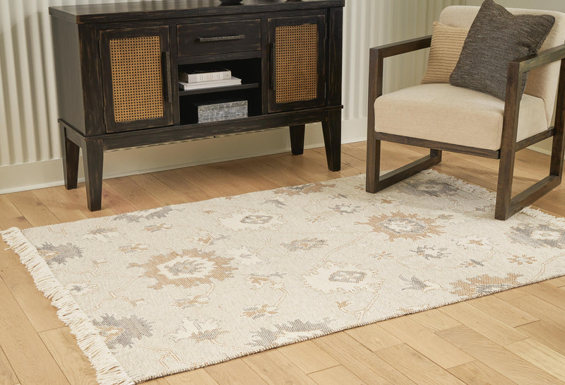 Ashley Furniture Calkin Rug featuring a textured pattern in neutral tones, ideal for adding warmth to living spaces.