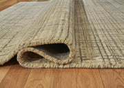 Close-up of Ashley Furniture Janston Rug showing its textured, woven design in neutral tones.