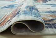 Close-up of Ashley Furniture Hessland Washable Rug, showing detailed pattern and soft texture in a neutral color.